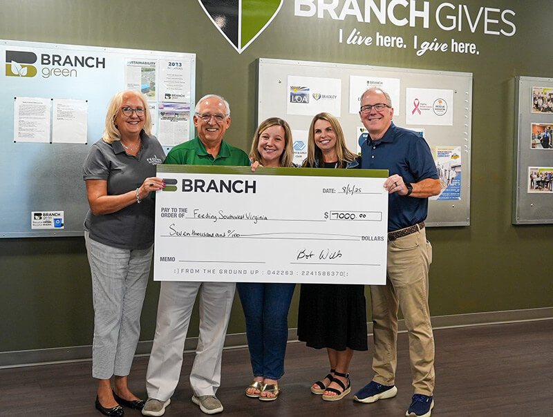 Branch Gives Employees Holding Big Check